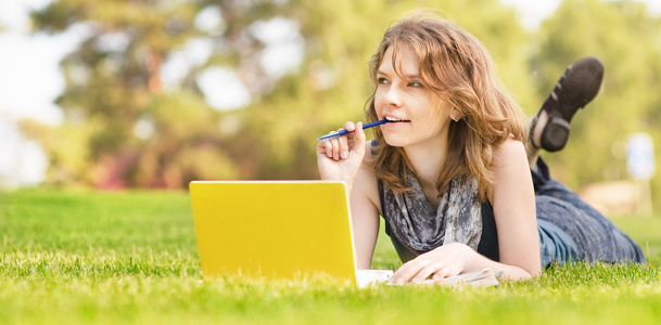 College Student Lying on Grass