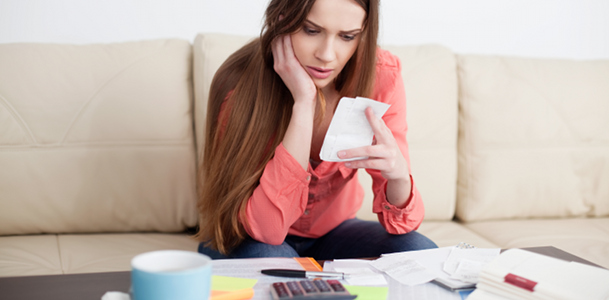 Concerned Woman Looking at Receipts