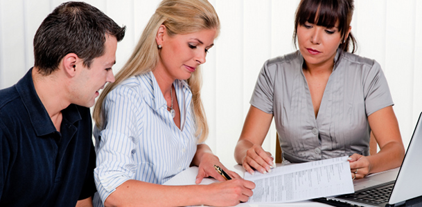 Couple Signing a Contract