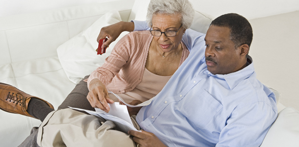 Older Couple Examining Bill